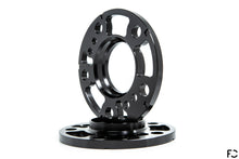 Load image into Gallery viewer, A 3/4 view of the Future Classic BMW wheel spacer machine work, pocketing, lug bolt holes, hub bolt hole provisions, and chamfered rear edges