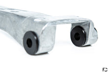 Load image into Gallery viewer, Close up of Future Classic Delrin AF carrier bushings in OEM G8X M3 / M4 shifter carrier