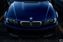 Load image into Gallery viewer, Overhead view of BMW chrome kidney grille set on Interlagos Blue E46 M3