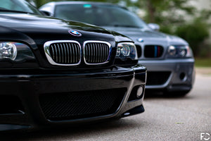 BMW chrome kidney grille set shown on Jet Black E46 M3