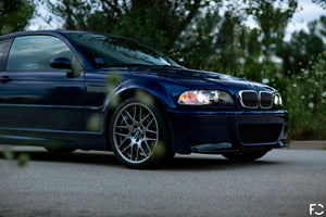 Angle view of BMW chrome kidney grille set on Interlagos Blue E46 M3