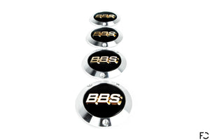 vertical stack of BBS E88 Center Cap Adaptor Set with black / gold 3D effect caps