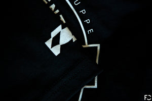 Closeup view of black Future Classic t-shirt sleeve tag