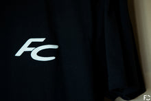 Load image into Gallery viewer, Close up view of black Future Classic t-shirt frontside with white FC logo text